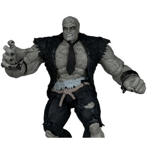 Action figure with a dark coat and tie on a white background