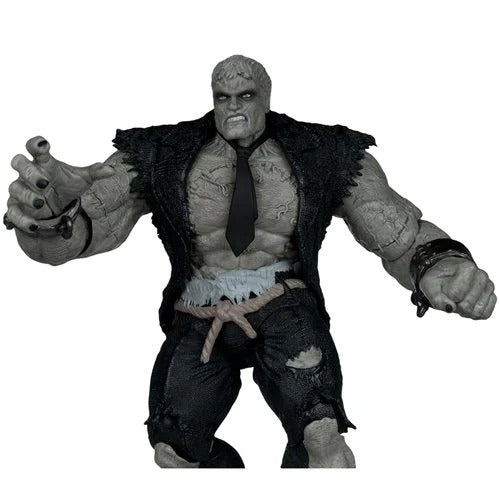 Action figure with a dark coat and tie on a white background