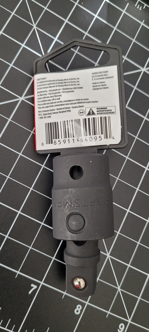 Black tool with a barcode label on a grid background