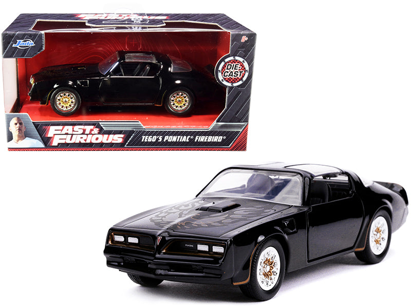 Tego's Pontiac Firebird Black with Gold Stripes and Hood Bird "Fast & Furious" Series 1/32 Diecast Model Car by Jada —
