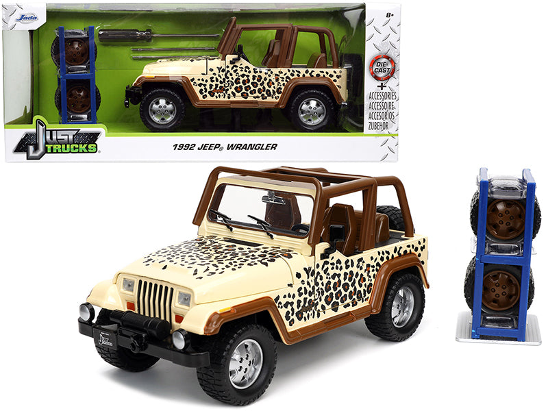 1992 Jeep Wrangler Tan and Brown with Graphics and Extra Wheels "Just Trucks" Series 1/24 Diecast Model Car by Jada —