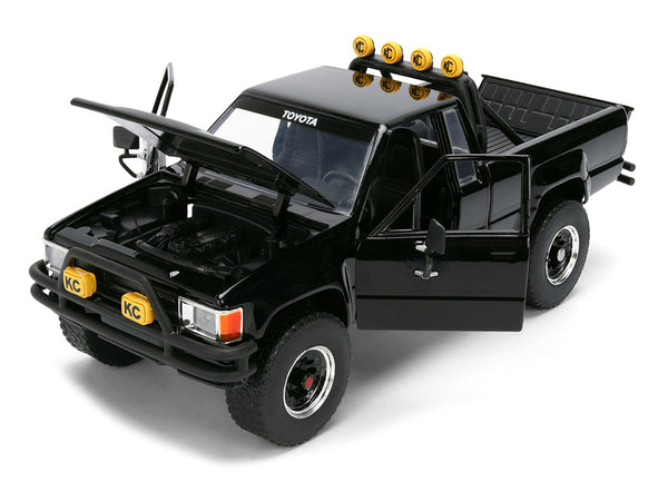 1985 Toyota SR5 Pickup Truck Black with Marty's Skateboard "Back to the Future" (1985) Movie "Hollywood Rides" Series 1/24 Diecast Model Car by Jada
