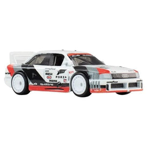 Hot Wheels Pop Culture 2026 - Select Vehicle(s) featuring a detailed white, red, and black Audi Quattro diecast car with racing decals, reflecting a veteran-owned, STEM-focused hobby brand.