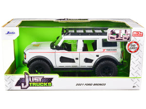 2021 Ford Bronco White with Red Stripes and Roof Rack "Yokohama Tires" "Just Trucks" Series 1/24 Diecast Model Car by Jada — Echo Six Hobbies, view 1