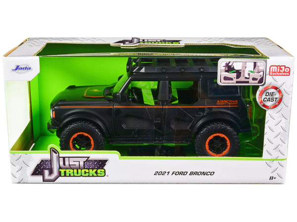 2021 Ford Bronco Matt Black with Orange Stripes and Roof Rack "Addictive Desert Designs" "Just Trucks" Series 1/24 Diecast Model Car by Jada — Echo Six Hobbies, view 1