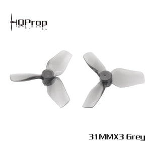 Two grey 3-blade drone propellers shown on a white background with the HQProp logo in the top-left and '31MMX3 Grey' text in the bottom-right.