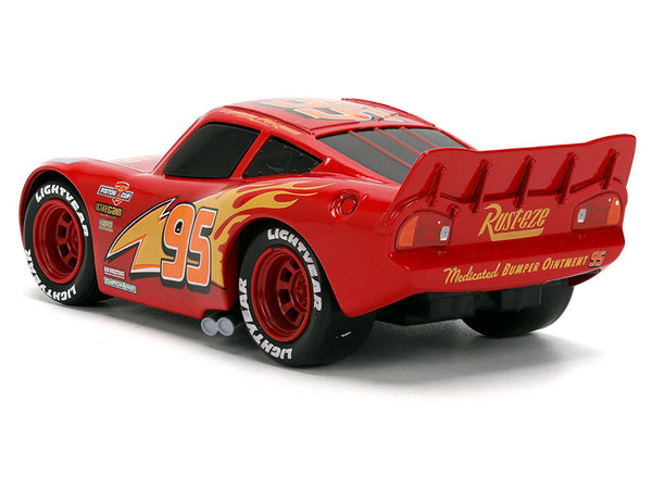 Echo Six Hobbies A red Lightning McQueen toy race car with yellow and orange flame decals, the number 95, and sponsor graphics including Rust-eze and Lightyear, shown on a white background.