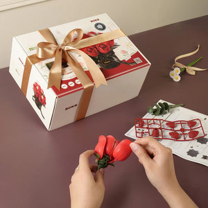 Echo Six Hobbies ROKR Red Rose Bouquet DIY 3D Puzzle, hands assembling a red rose from kit parts