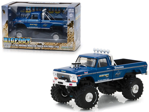 Blue Bigfoot monster truck model with oversized wheels next to its packaging on a white background