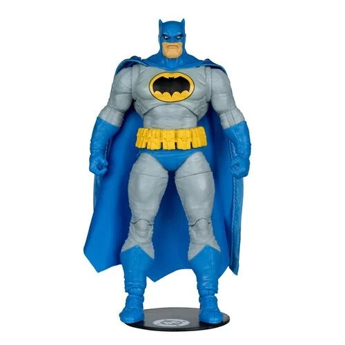 Batman action figure with blue cape and yellow bat symbol on a white background