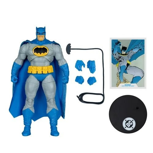 Batman action figure with accessories and promotional material on a white background