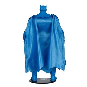 A blue Batman figure or collectible statue shown from the back, wearing a flowing cape and cowl, standing on a round black base against a plain white background.
