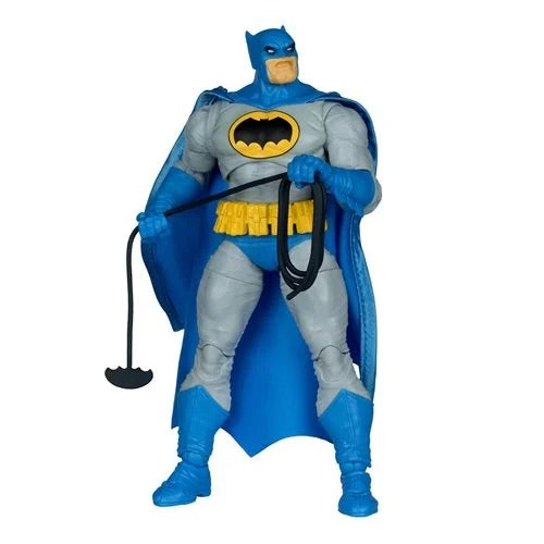 Batman action figure with blue cape and yellow belt on a white background