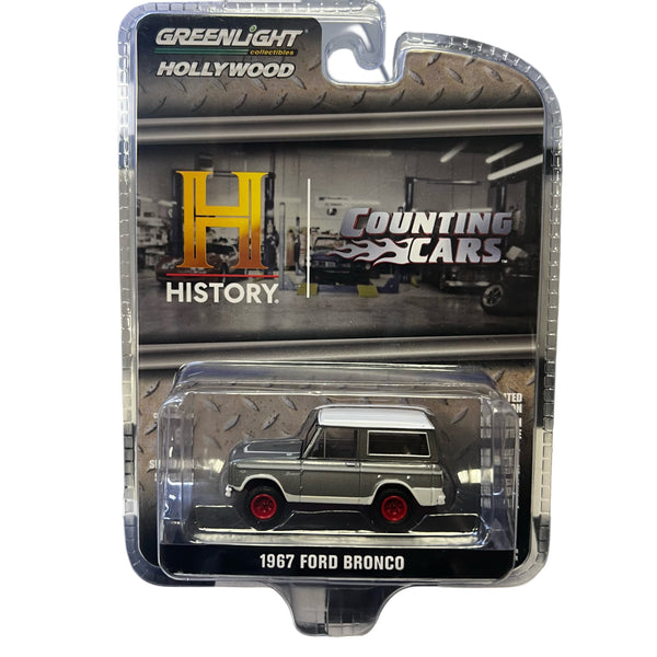 1967 Ford Bronco model car in packaging with 'Greenlight Hollywood' and 'Counting Cars' branding.