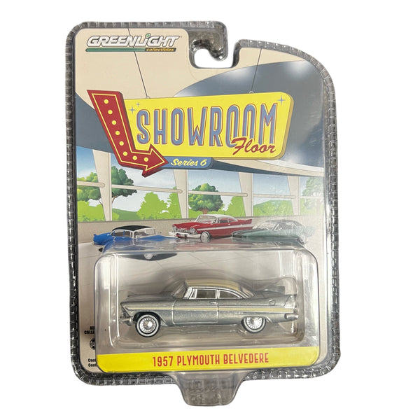 1957 Plymouth Belvedere model car in packaging with 'Showroom Floor' display background