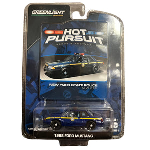 Model car in packaging with 'Hot Pursuit' branding on a white background