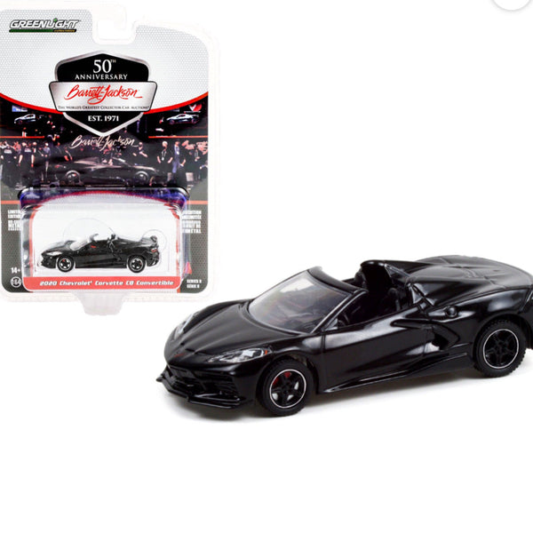 Black convertible car model with packaging on a white background