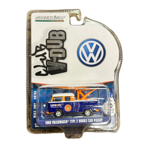 Model Volkswagen truck in packaging with Greenlight and V-Dub branding.