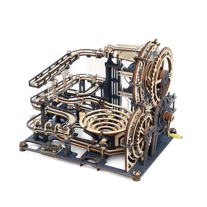 Mechanical model with gears and metal components on a white background