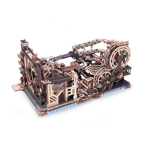 Wooden mechanical model with intricate gears on a white background