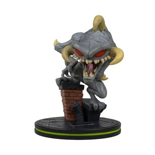 A stylized collectible figurine of a gray monster with red eyes, yellow horns, and a brick chimney base, shown on a plain white background.
