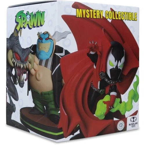 Spawn Mystery Collectible figure box by Marbles Toys, featuring artwork of Spawn with his red cape and green smoke, along with a monster and a blue-faced character on a white background.