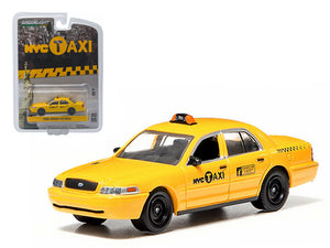 Model yellow taxi with 'N.Y.C. Taxi' branding on a white background