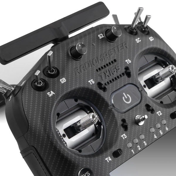 Close-up of a RadioMaster TX16S drone remote control with carbon fiber texture.
