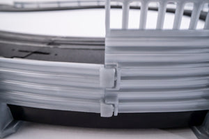 Echo Six Hobbies AFX Racing Close-up of a gray plastic crate with a latch on a white background