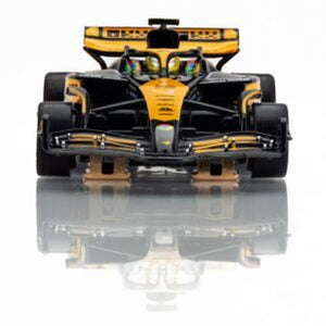 Echo Six Hobbies AFX 22103 Black and yellow Formula 1 car on a reflective surface with a white background