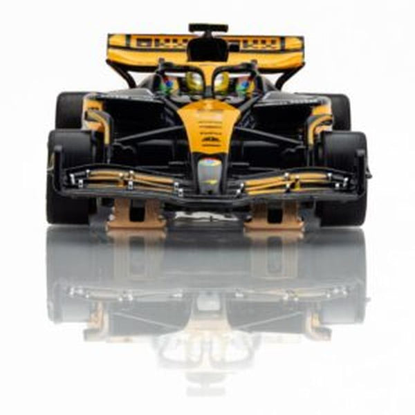 Echo Six Hobbies AFX 22103 Black and yellow Formula 1 car on a reflective surface with a white background