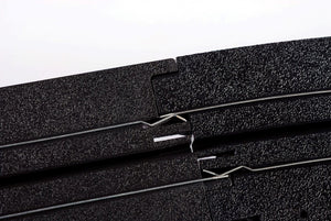 Echo Six Hobbies AFX Racing Close-up of a black HO slot car track with a white background