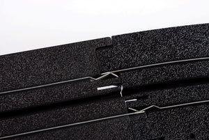 Echo Six Hobbies AFX Racing Close-up of black foam rubber sheets with a white background