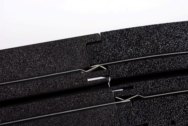 Echo Six Hobbies AFX Racing Close-up of black foam rubber sheets with a white background