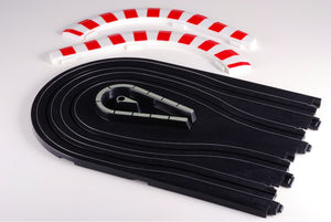 Echo Six Hobbies AFX Racing Black slot car track with a white and red striped on a light gray background