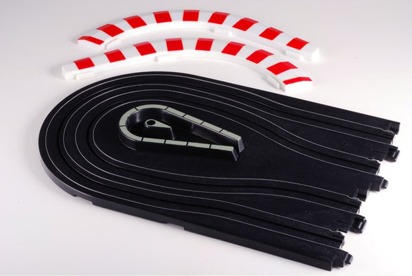 Echo Six Hobbies AFX Racing Black slot car track with a white and red striped on a light gray background