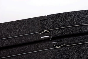Echo Six Hobbies AFX Racing Close-up of black HO Slot car track with a white background
