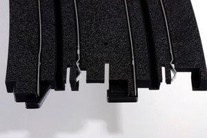 Echo Six Hobbies AFX Racing Close-up of black rubber matting with a white background