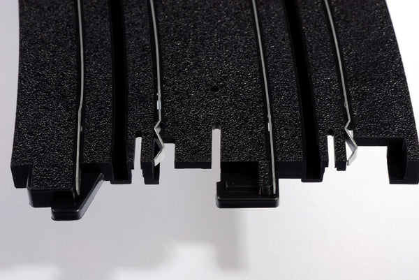Echo Six Hobbies AFX Racing Close-up of black rubber matting with a white background