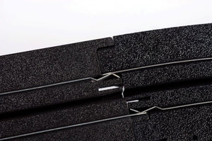 Echo Six Hobbies AFX Racing Close-up of black foam rubber sheets with a white background