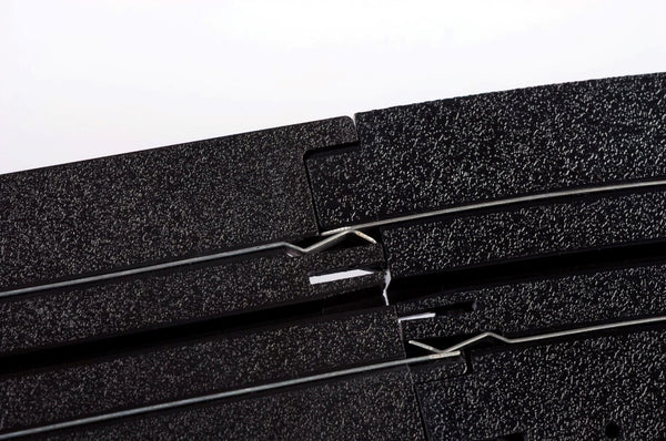Echo Six Hobbies AFX Racing Close-up of black foam rubber sheets with a white background