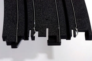 Echo Six Hobbies AFX Racing Close-up of black plastic strips on a white background