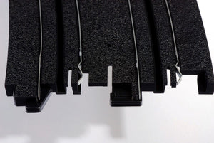 Echo Six Hobbies AFX Racing Close-up of black rubber matting with a white background