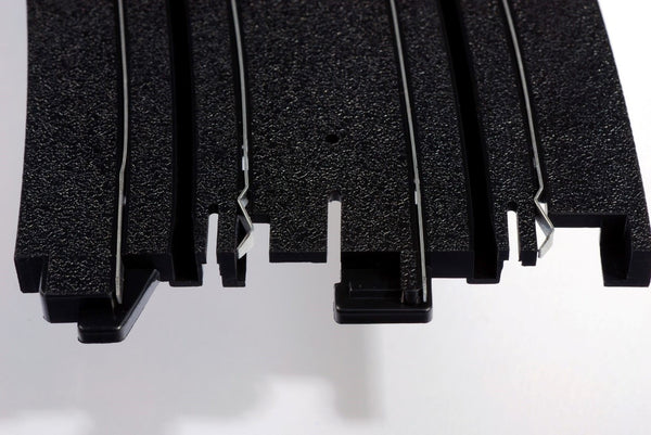 Echo Six Hobbies AFX Racing Close-up of black rubber matting with a white background