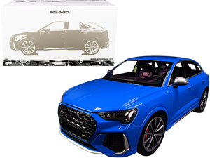 Blue car model with Minichamps packaging on a white background