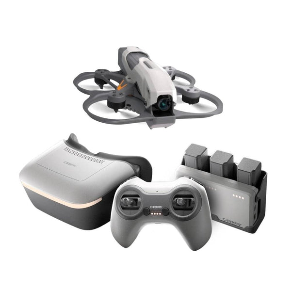 A drone control kit featuring a small quadcopter drone, a white and gray VR headset, a matching wireless controller, and a battery charger on a plain white background.