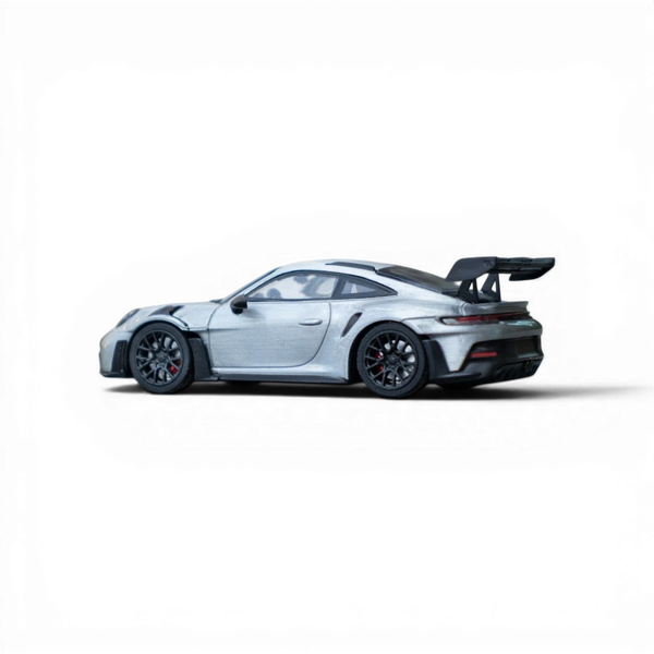 Silver Porsche on a black background