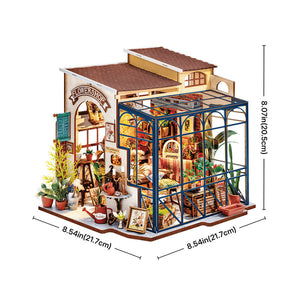 A miniature wooden dollhouse building with a greenhouse extension, shown on a white background with dimension lines and measurements indicating 8.54 inches by 8.