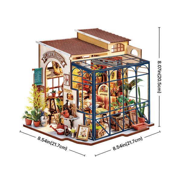 A miniature wooden dollhouse building with a greenhouse extension, shown on a white background with dimension lines and measurements indicating 8.54 inches by 8.