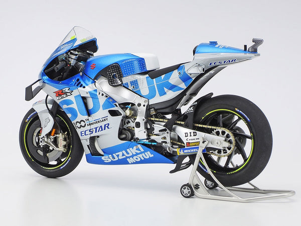 Model motorcycle on a stand with visible branding on a white background